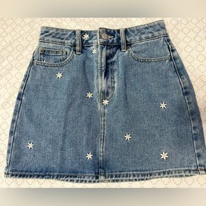Denim mini skirt, with daisy’s unused.